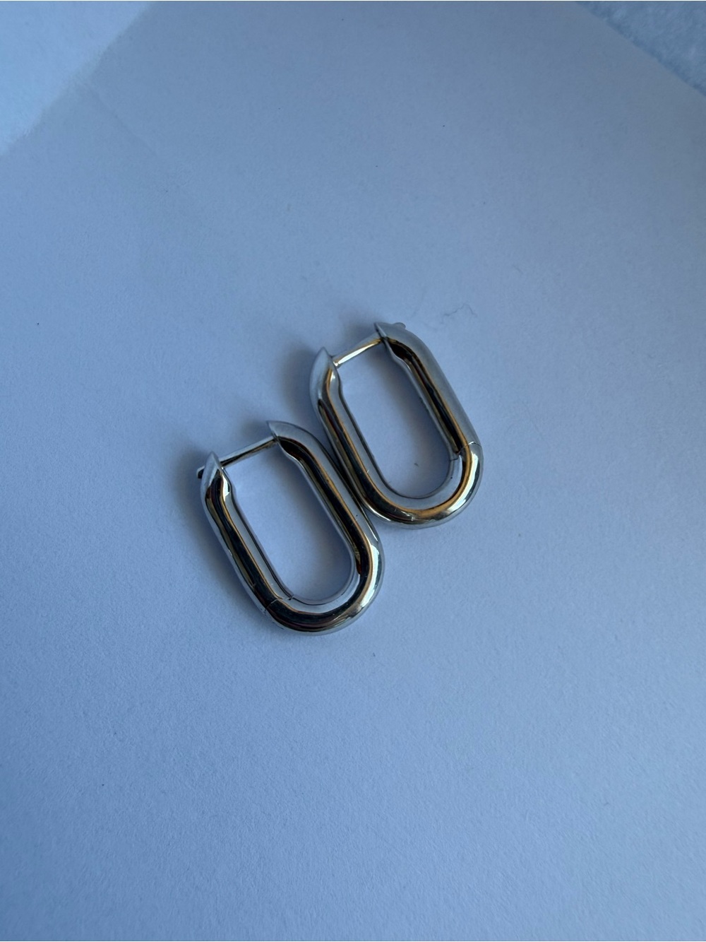 Sterling Silver Oval Huggie Earrings - Polished Silver Tone